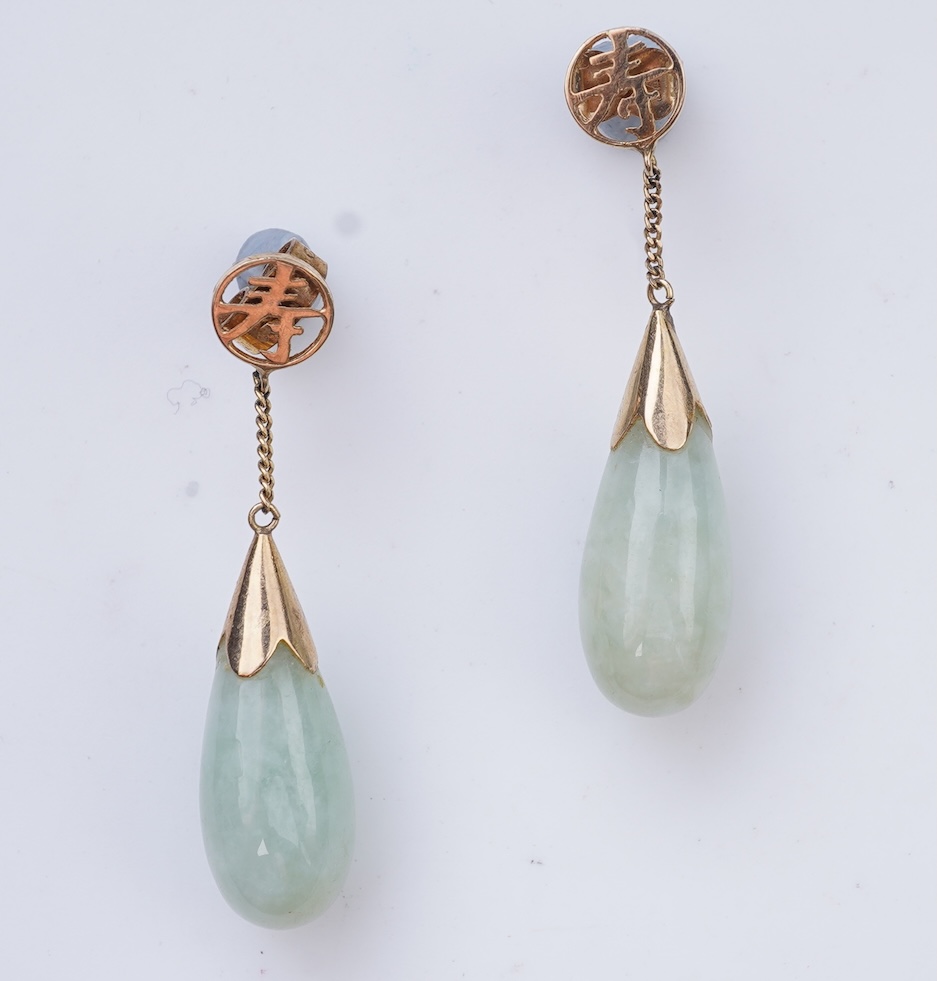 A collection of jadeite jewels, comprising: a bead bracelet with a silver clasp; together with three pairs of studs; one pair of hoop studs, one broken and restuck; and one pair of drop earrings, each set with jadeite, m
